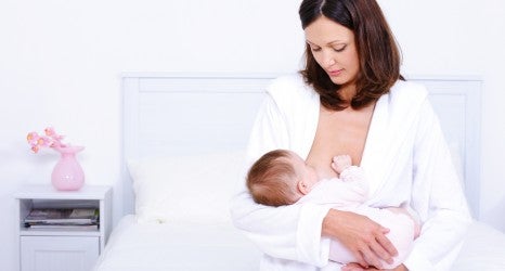 Mother feeding baby with breast